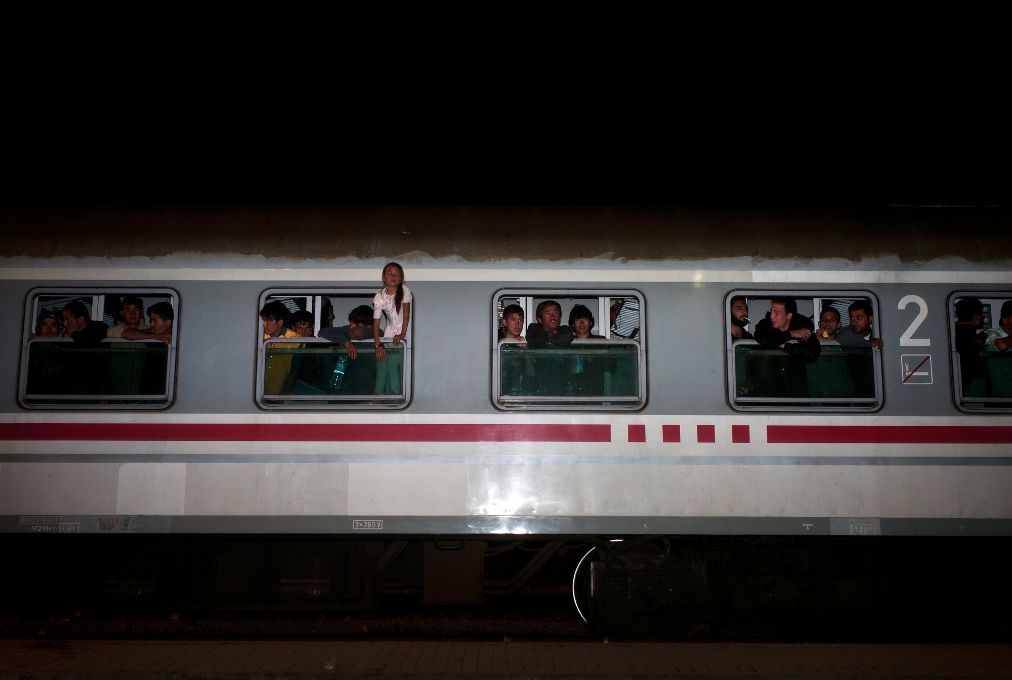 Refugees just boarded on a train in Torvanik, Croatia. The refugees are travelling by trains and busses, through the Balkan region, to get to Germany. October 1, 2015 / Ðñüóöõãåò ìüëéò åðéâéâÜóôçêáí óå ôñáßíï óôçí êùìüðïëç ÔïñâÜíéê, Êñïáôßá. Ïé ðñüóöõãåò äéáó÷ßæïõí ôá ÂáëêÜíéá, ôáîéäåýïíôáò ìå ôñáßíá êáé ëåùöïñåßá, ìå ôåëéêü ðñïïñéóìü ôçí Ãåñìáíßá. 1, Ïêôþâñéïò 2015